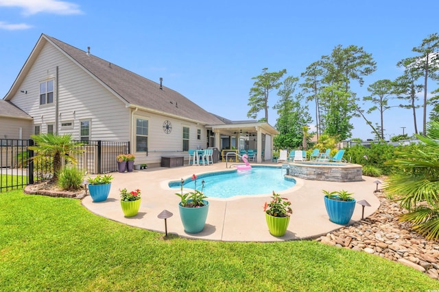 1715 Lake Egret Dr, North Myrtle Beach, SC 29582 - view of pool with a patio, ceiling fan, a fenced backyard, and a pool with connected hot tub