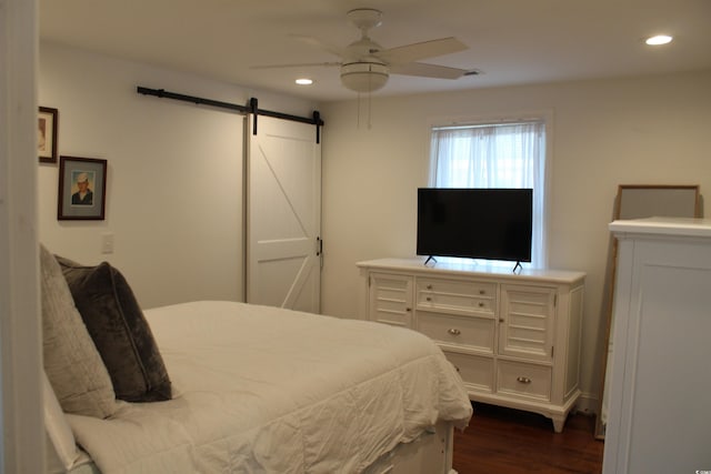 1600 Beaver Rd, Myrtle Beach, SC 29577 - bedroom featuring a barn door, recessed lighting, dark wood-type flooring, and ceiling fan