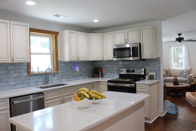 1600 Beaver Rd, Myrtle Beach, SC 29577 - kitchen with stainless steel appliances, plenty of natural light, light countertops, dark wood-style floors, and recessed lighting