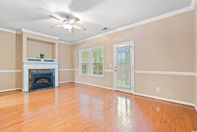 1654 Low Country Pl Unit C, Myrtle Beach, SC 29577 - unfurnished living room featuring ceiling fan, wood finished floors, a fireplace, and ornamental molding