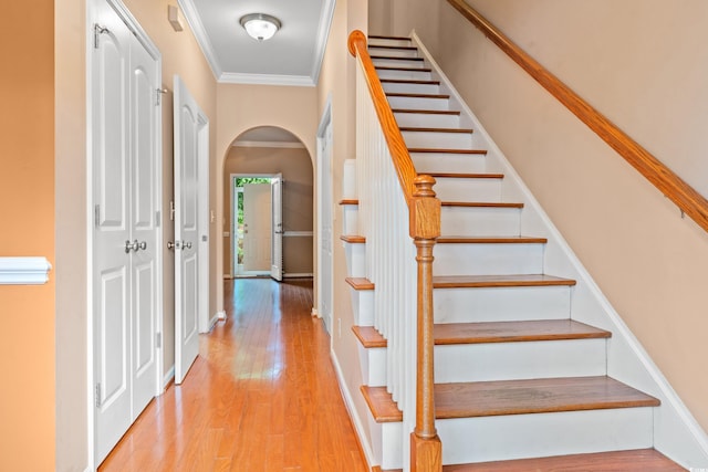 1654 Low Country Pl Unit C, Myrtle Beach, SC 29577 - stairs featuring wood finished floors, ornamental molding, and arched walkways
