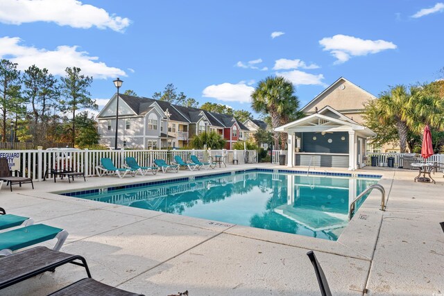 1654 Low Country Pl Unit C, Myrtle Beach, SC 29577 - community pool featuring a patio area and a residential view