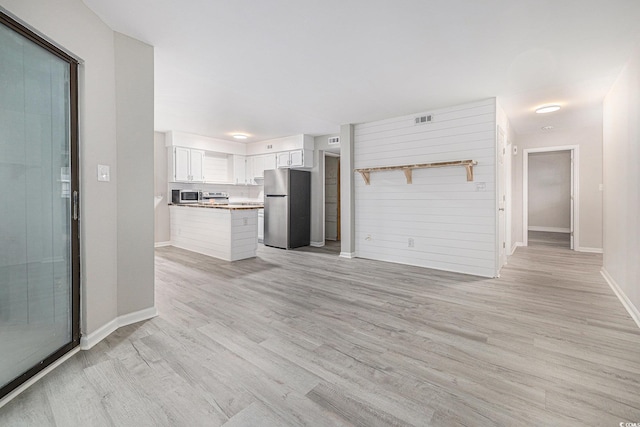 1500 Cenith Dr Unit B-403, North Myrtle Beach, SC 29582 - unfurnished living room featuring light wood-type flooring and baseboards