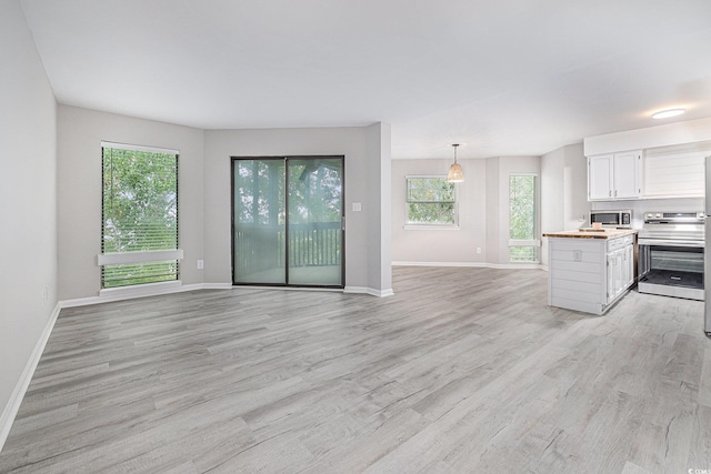 1500 Cenith Dr Unit B-403, North Myrtle Beach, SC 29582 - kitchen with stainless steel appliances, plenty of natural light, and light wood finished floors