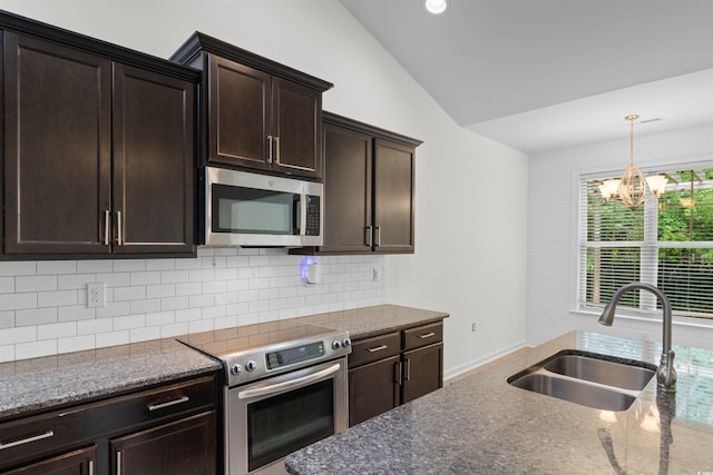 124 Shady Arbor Loop, Longs, SC 29568 - kitchen with stainless steel appliances, lofted ceiling, a chandelier, dark brown cabinets, and decorative backsplash