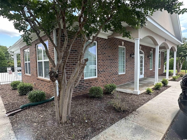 124 Shady Arbor Loop, Longs, SC 29568 - view of home's exterior featuring brick siding and a porch