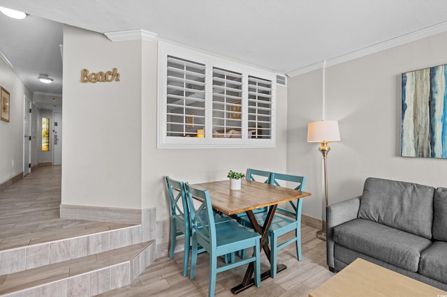 4800 S Ocean Blvd Unit 1524, North Myrtle Beach, SC 29582 - dining space featuring crown molding and wood finished floors