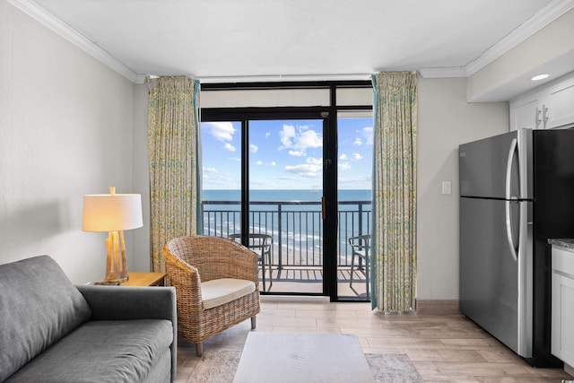 4800 S Ocean Blvd Unit 1524, North Myrtle Beach, SC 29582 - living area with crown molding, a water view, light wood-style floors, and expansive windows