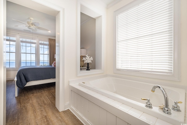 611 N Ocean Blvd, Surfside Beach, SC 29575 - ensuite bathroom featuring a bath, a ceiling fan, and crown molding