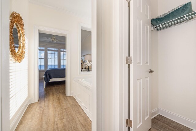 611 N Ocean Blvd, Surfside Beach, SC 29575 - corridor with crown molding and light wood finished floors