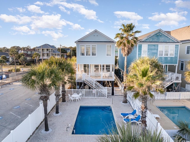 611 N Ocean Blvd, Surfside Beach, SC 29575 - rear view of property with stairs, a fenced backyard, a residential view, and a patio area