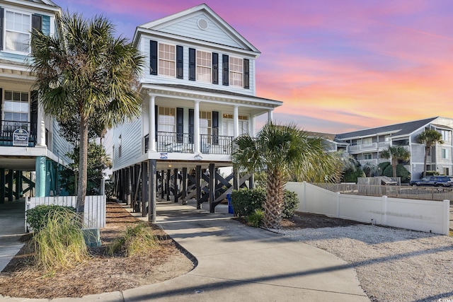 611 N Ocean Blvd, Surfside Beach, SC 29575 - raised beach house with a carport, covered porch, and stairway