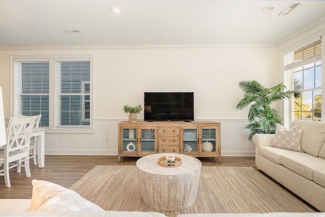 611 N Ocean Blvd, Surfside Beach, SC 29575 - living room with wood finished floors, wainscoting, crown molding, and recessed lighting