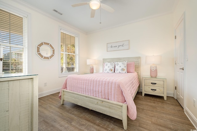 611 N Ocean Blvd, Surfside Beach, SC 29575 - bedroom featuring crown molding, wood finished floors, and a ceiling fan