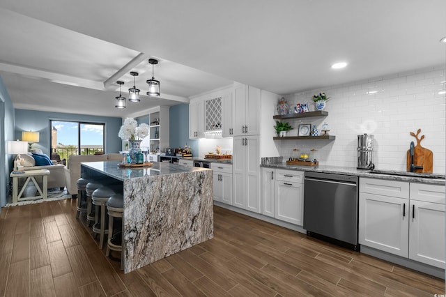 7601 N Ocean Blvd Unit 7-C, Myrtle Beach, SC 29572 - kitchen with stainless steel dishwasher, open shelves, dark stone countertops, white cabinets, and recessed lighting