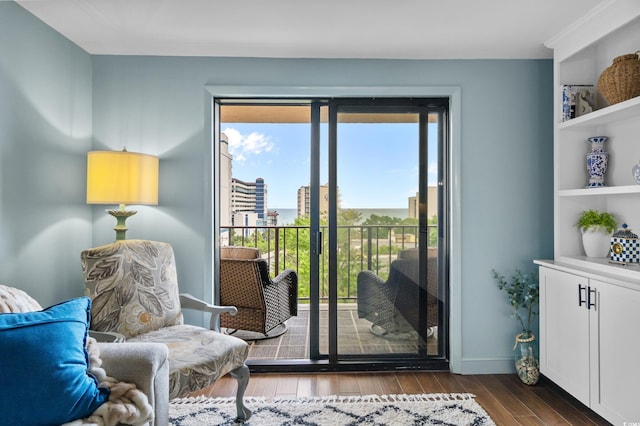 7601 N Ocean Blvd Unit 7-C, Myrtle Beach, SC 29572 - sitting room featuring dark wood-style flooring and baseboards