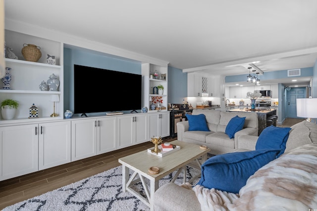 7601 N Ocean Blvd Unit 7-C, Myrtle Beach, SC 29572 - living room featuring dark wood finished floors and built in features