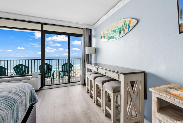 201 74th Ave N Unit 2534, Myrtle Beach, SC 29572 - bedroom featuring a water view, access to outside, crown molding, and wood finished floors