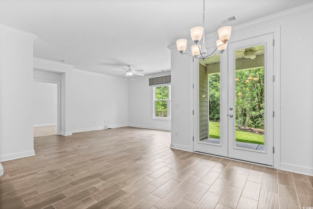 124 Castaway Key Dr, Pawleys Island, SC 29585 - empty room with ceiling fan, wood finished floors, a chandelier, and ornamental molding