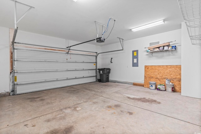 124 Castaway Key Dr, Pawleys Island, SC 29585 - garage featuring electric panel and a garage door opener