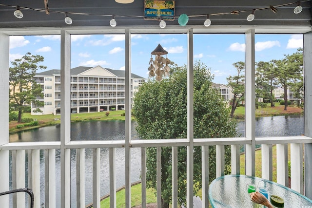 305 Hillside Dr N Unit 205, North Myrtle Beach, SC 29582 - unfurnished sunroom with a water view