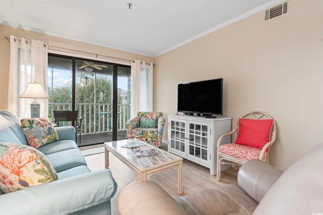305 Hillside Dr N Unit 205, North Myrtle Beach, SC 29582 - living room with crown molding, wood finished floors, and a textured ceiling