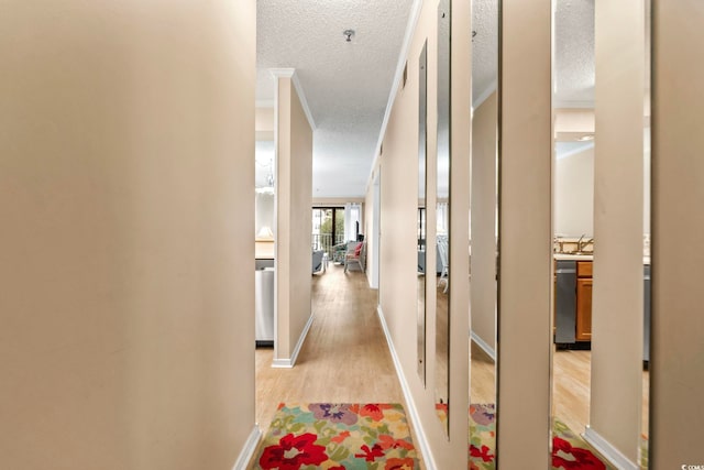 305 Hillside Dr N Unit 205, North Myrtle Beach, SC 29582 - hall featuring ornamental molding, a textured ceiling, and light wood-type flooring