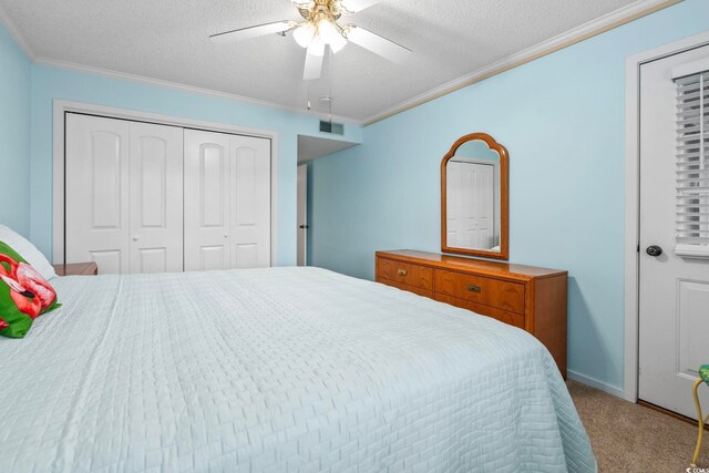 305 Hillside Dr N Unit 205, North Myrtle Beach, SC 29582 - carpeted bedroom with crown molding, a textured ceiling, a closet, and ceiling fan