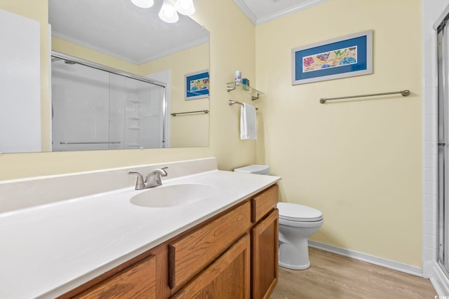 305 Hillside Dr N Unit 205, North Myrtle Beach, SC 29582 - bathroom featuring ornamental molding, vanity, wood finished floors, and an enclosed shower