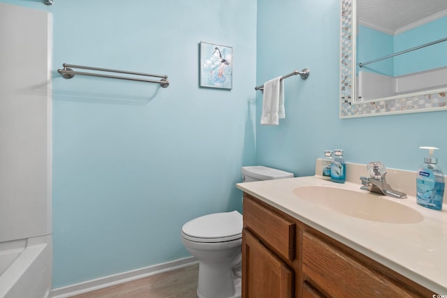 305 Hillside Dr N Unit 205, North Myrtle Beach, SC 29582 - full bath with ornamental molding, vanity, wood finished floors, a textured ceiling, and shower / tub combination