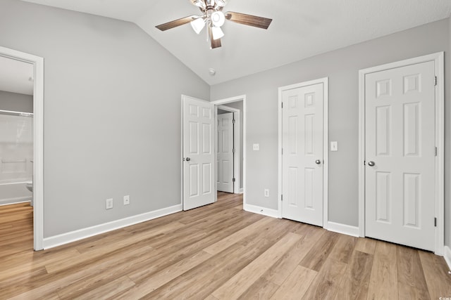 2965 Mount Olive Rd, Loris, SC 29569 - unfurnished bedroom featuring light wood-style flooring, lofted ceiling, ensuite bath, and ceiling fan