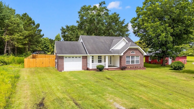 2965 Mount Olive Rd, Loris, SC 29569 - view of front of house with an attached garage, brick siding, a front yard, and covered porch