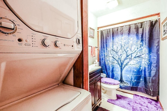 404 72nd Ave N Unit 301, Myrtle Beach, SC 29572 - full bath featuring stacked washer / drying machine, vanity, and a shower with shower curtain