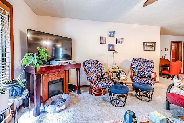 404 72nd Ave N Unit 301, Myrtle Beach, SC 29572 - carpeted living room with baseboards and a glass covered fireplace