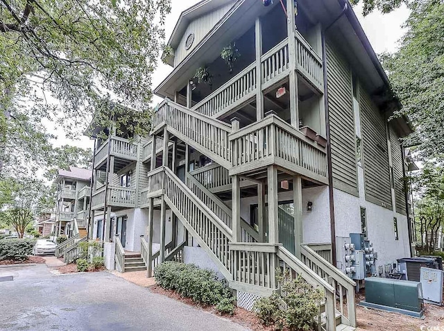404 72nd Ave N Unit 301, Myrtle Beach, SC 29572 - view of side of property featuring stucco siding
