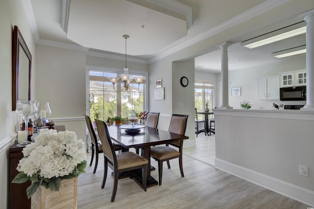 2180 Waterview Dr Unit 738, North Myrtle Beach, SC 29582 - dining area with ornate columns, light wood-style floors, a chandelier, and ornamental molding
