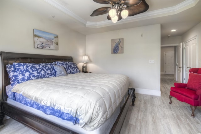 2180 Waterview Dr Unit 738, North Myrtle Beach, SC 29582 - bedroom featuring wood finished floors, ornamental molding, a raised ceiling, and a ceiling fan