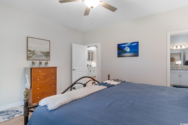 3185 Viceroy Loop, Little River, SC 29566 - bedroom with wood finished floors, connected bathroom, and ceiling fan