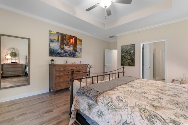 3185 Viceroy Loop, Little River, SC 29566 - bedroom with light wood finished floors, crown molding, a tray ceiling, and a ceiling fan