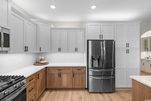 3185 Viceroy Loop, Little River, SC 29566 - kitchen with appliances with stainless steel finishes, light countertops, light wood finished floors, recessed lighting, and white cabinets