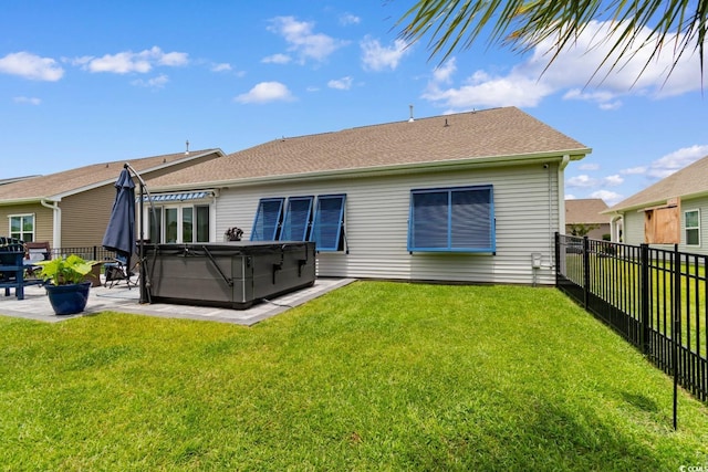 3185 Viceroy Loop, Little River, SC 29566 - back of house featuring a hot tub, a patio area, a fenced backyard, and roof with shingles
