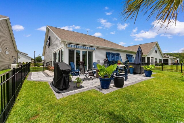 3185 Viceroy Loop, Little River, SC 29566 - back of property featuring a patio, a fenced backyard, and a shingled roof