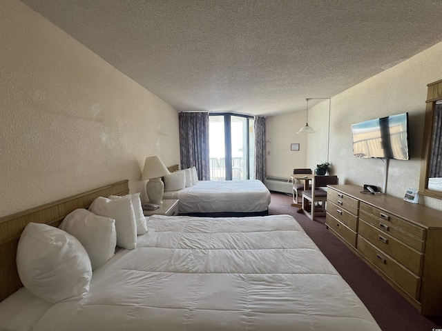 9550 Shore Dr Unit 1733, Myrtle Beach, SC 29579 - bedroom with a textured wall, dark carpet, and a textured ceiling
