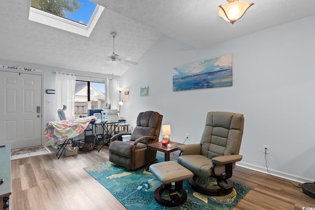 620 15th Ave S Unit 87, Surfside Beach, SC 29575 - sitting room with a textured ceiling, wood finished floors, a skylight, vaulted ceiling, and ceiling fan