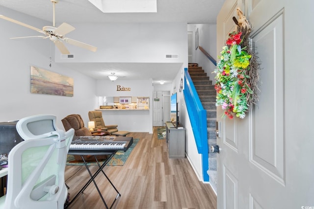 620 15th Ave S Unit 87, Surfside Beach, SC 29575 - entryway featuring light wood finished floors, a skylight, stairway, and a ceiling fan