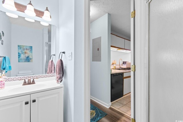 620 15th Ave S Unit 87, Surfside Beach, SC 29575 - full bath featuring vanity, electric panel, a shower with door, and wood finished floors