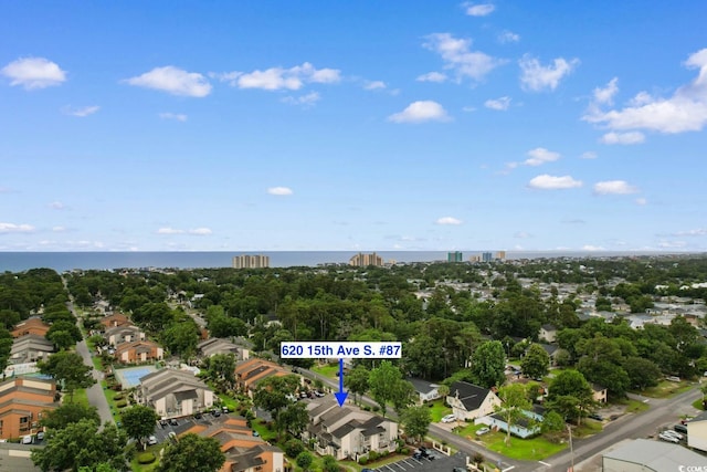 620 15th Ave S Unit 87, Surfside Beach, SC 29575 - aerial view of residential area with a tree filled landscape and a nearby body of water