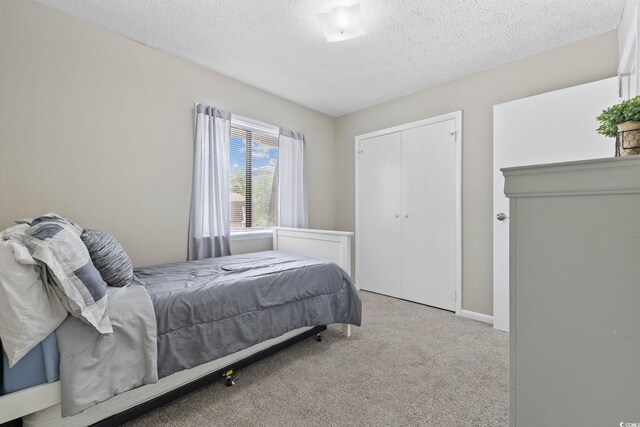 615 Carter Ln Unit D6, Conway, SC 29526 - carpeted bedroom with a textured ceiling and a closet