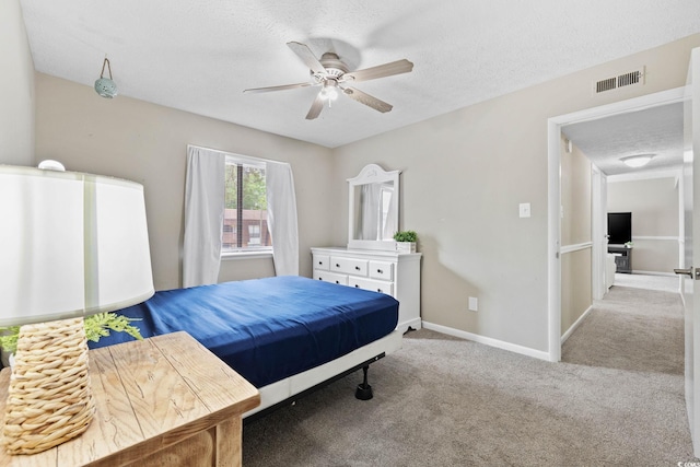 615 Carter Ln Unit D6, Conway, SC 29526 - bedroom featuring a textured ceiling, carpet floors, and ceiling fan