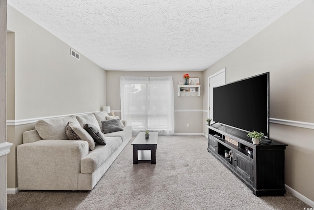 615 Carter Ln Unit D6, Conway, SC 29526 - carpeted living area featuring a textured ceiling and baseboards